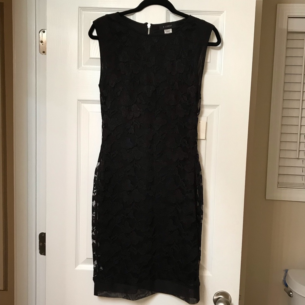 Little Black Cocktail Dress. Lace embellishments.